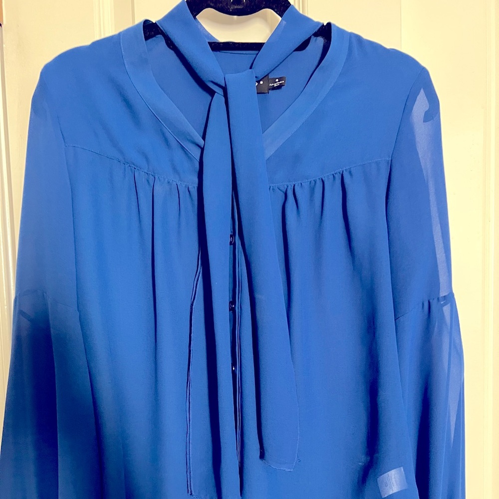 Beautiful cobalt blue semi-sheer blouse with attached ties, worn in frt or bck
